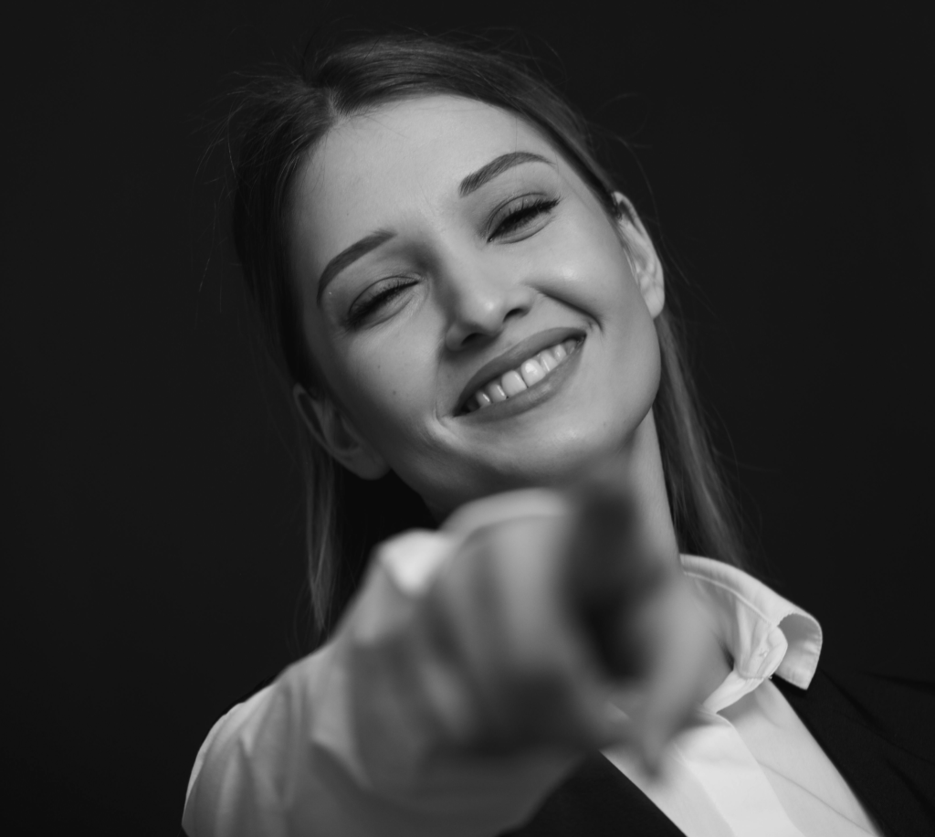 A young woman smiles and invites you to subscribe to receive the latest news