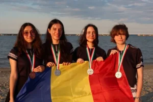 The four students from the Romanian team with the silver and bronze medals at the 2026 European Olympiad in Informatics for Girls